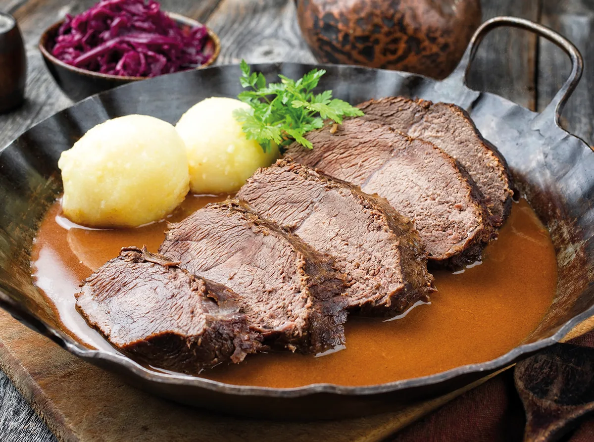 Rheinischer Sauerbraten - marinated pot roast with dumplings and apple sauce (Dusseldorf, Germany)