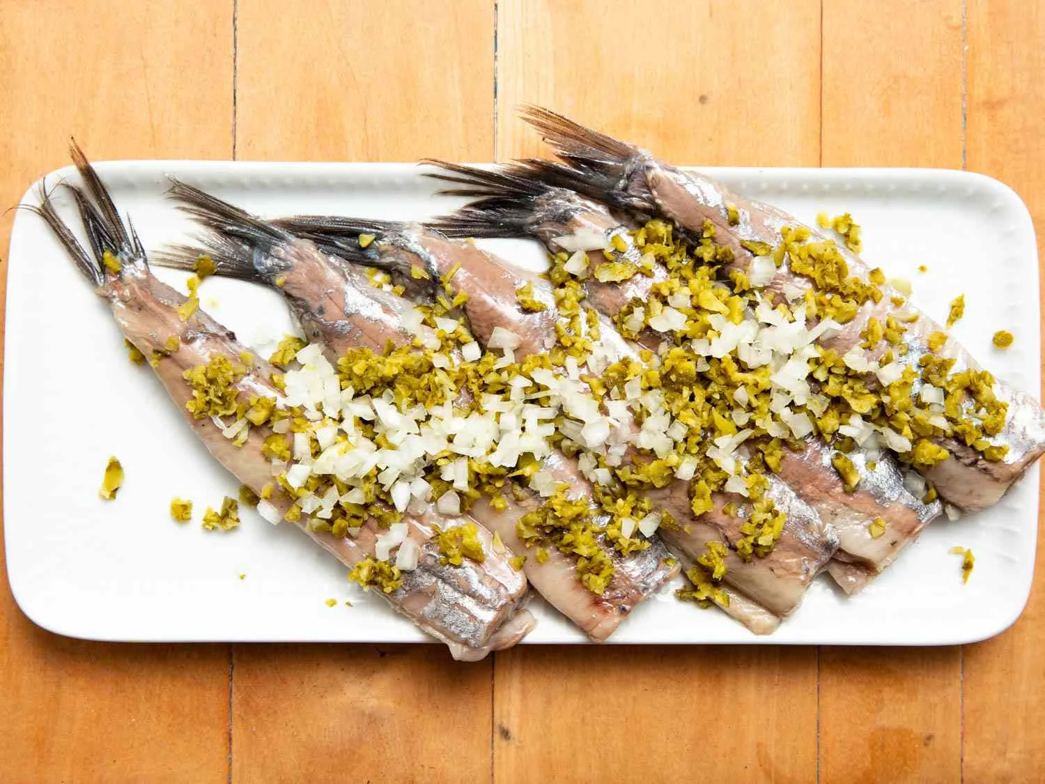 Hollandse Nieuwe Haring - raw Dutch herring with onion and pickles (The Hague)